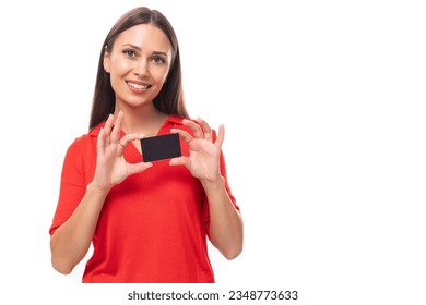 young attractive brunette woman in red stylish v-neck blouse holding credit card mockup