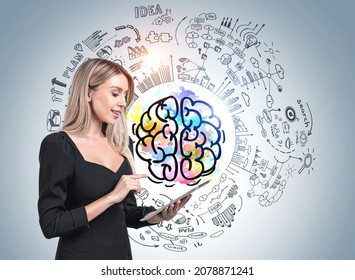 Young Attractive Businesswoman In Formal Suit Is Standing In Front Of Colourful Sketch With Brain, Goal, Bar And Pie Diagram In Background. Concept Of Imagination And Brainstorming For Creative Idea