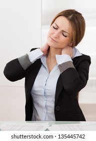 Young Attractive Businesswoman Suffer From Neck Pain