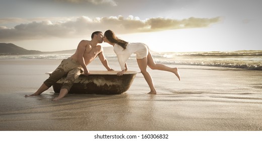 Young attractive caucasian couple on beach with vintage bath tub