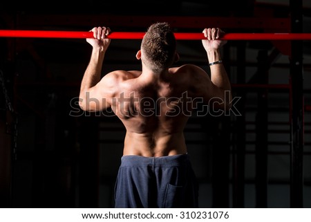 Similar – Image, Stock Photo Muscular man doing chin-ups