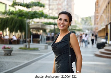 Young Attractive Cheerful Woman Walking In City.