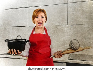 Young Attractive Cook Woman Desperate In Stress In Apron Holding Cooking Pot And Rolling Pin At Home Kitchen Screaming Frustrated And Confused In Lifestyle Concept Dirty Grunge Background Edit
