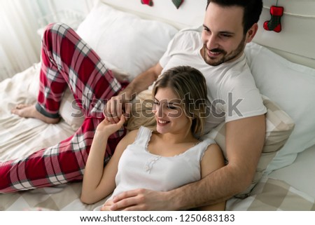 Similar – Image, Stock Photo Man and pregnant woman looking baby clothes