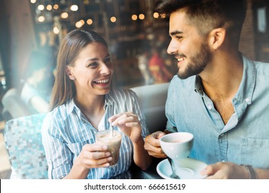 Young attractive couple on date in coffee shop - Powered by Shutterstock