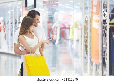 Young Attractive Couple In Shop Window