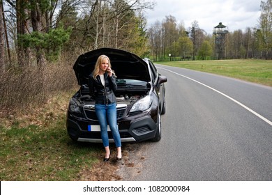 Young Attractive Desperate And Confused Woman Stranded On Roadside With Broken Car Engine Failure Crash Accident Calling On Mobile Phone For Mechanic Assistance In Insurance Company Concept