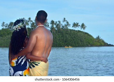 Young Attractive, Exotic, Healthy, Romantic Polynesian Cook Islanders Couple Looking At Muri Lagoon During A Honeymoon Trip In Rarotonga, Cook Islands. Real People. Copy Space