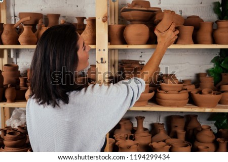 Similar – Beautiful ceramist owner looking to the camera while smiling