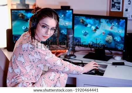 Young attractive girl gamer streaming online wearing cute pajamas clothes
