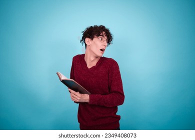 Young attractive guy posing in the studio. The student is in college.