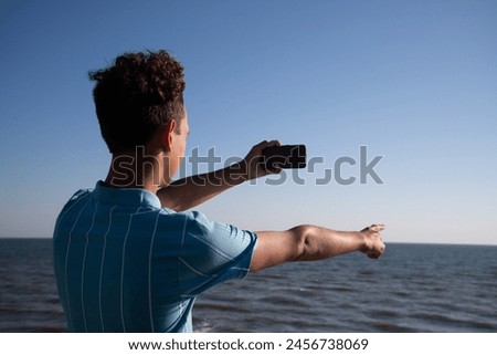 Similar – zwei erwachsene und ein kind in badebekleidung auf einem roller am meer. verschwommen