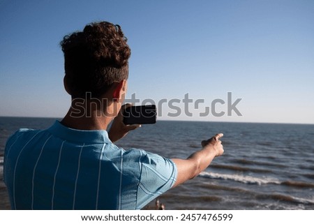 Similar – zwei erwachsene und ein kind in badebekleidung auf einem roller am meer. verschwommen