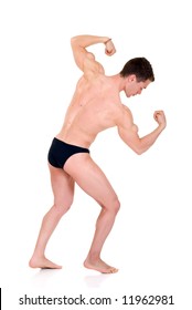 Young attractive male body builder, demonstrating contest pose. Studio shot, white background.