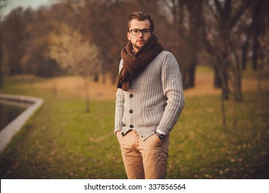 Young Attractive Man In Cardigan And Glasses