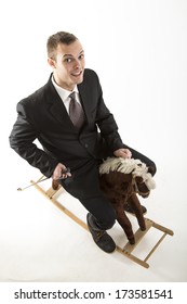 Young Attractive Man On Rocking Horse