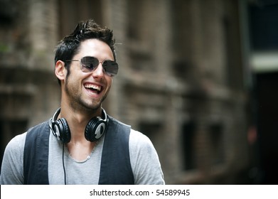 Young attractive man in urban background