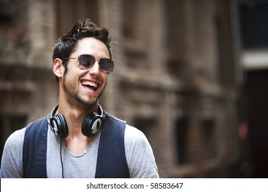 Young Attractive Man In Urban Background