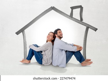 Young Attractive And Modern Couple In Love Smiling Happy Together Sitting On Floor Thinking And Imaging Their New House, Home, Flat Or Apartment In Real State Concept