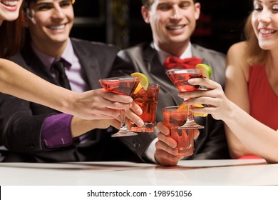 Young Attractive People Of Four Having Cocktail Party