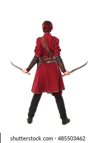 Young And Attractive Red Haired  Female Warrior,  Wearing A Red Medieval Tunic And Leather Armour.  Isolated On A White