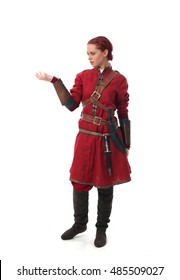 young and attractive red haired  female warrior,  wearing a red medieval tunic and leather Armour.  isolated on a white