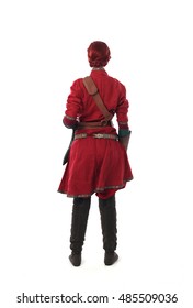 Young And Attractive Red Haired  Female Warrior,  Wearing A Red Medieval Tunic And Leather Armour.  Isolated On A White