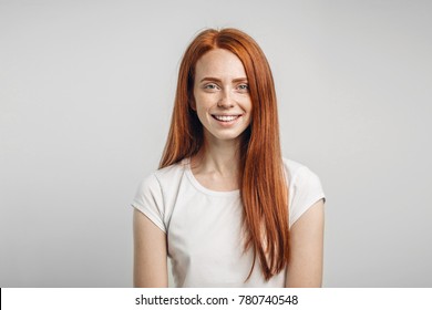 Young Attractive Redhead Girl Smiling Looking At Camera