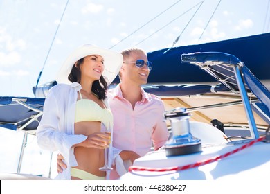 Young, Attractive And Rich Couple Have A Party On A Luxury Sailing Boat At Summer