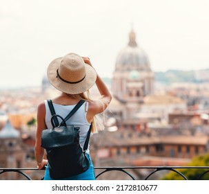 Young attractive smiling girl tourist in hat exploring new Europe city at summer holiday - Shutterstock ID 2172810677