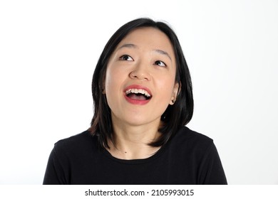 Young Attractive South East Asian Woman Pose Face Expression Emotion On White Background Wonder Happy Look Up
