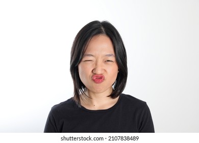 Young Attractive South East Asian Woman Pose Face Expression Emotion On White Background Kiss