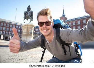 Young Attractive Student Backpacker Tourist Taking Selfie Photo With Mobile Phone Outdoors Enjoying Holidays Travel Destination In Tourism And Exploring Concept