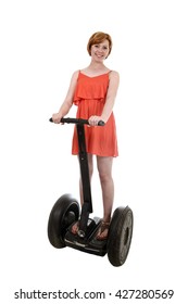 Young Attractive Tourist Woman In Chic Summer Dress Smiling Happy Riding Electrical Segway Having Fun Driving Isolated On White Background In Ecological Transport Concept