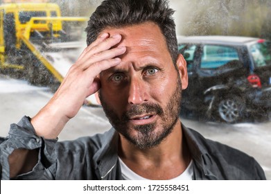 young attractive upset and stressed man feeling overwhelmed after suffering car accident damaging the vehicle for insurance company advertising