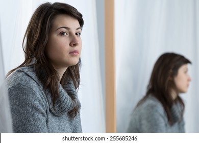 Young attractive woman in a bad mood