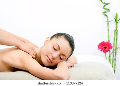 Young Attractive Woman Enjoying Neck Massage.