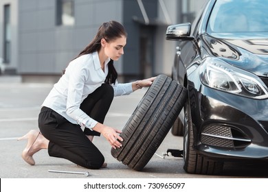 Girl Changing Tyre