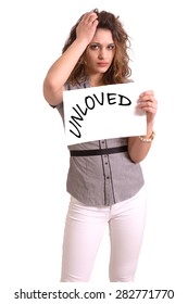 Young Attractive Woman Holding Paper With Unloved Text On White Background