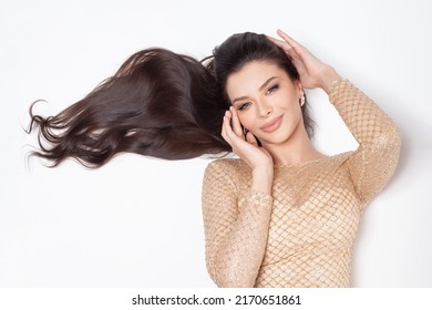 Young Attractive Woman With Long Shiny Dark Hair Smiling On White Background Portrait