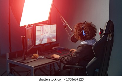 Young Attractive Woman Playing Video Games On Her Computer Wearing Gaming Headset.