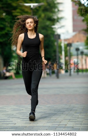 Similar – Black woman afro hairstyle running outdoors in urban road