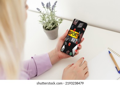 Young attractive woman showing sincere excitement about victory in online lottery. Girl being happy winning a bet in online sport gambling application on her mobile phone - Shutterstock ID 2193238479