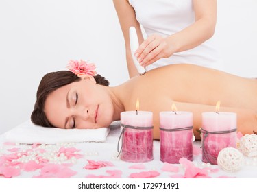 Young Attractive Woman Undergoes Microdermabrasion Therapy In Spa