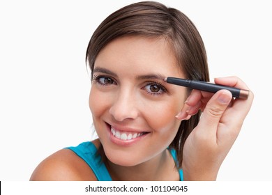 Young Attractive Woman Using An Eyebrow Pencil To Make-up