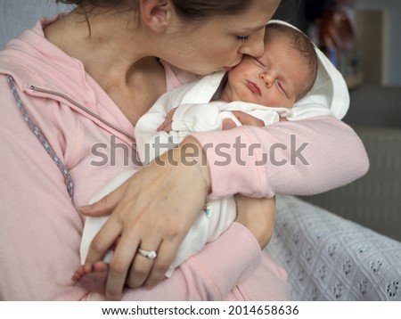 Similar – Image, Stock Photo Mother hugging her sleeping baby girl