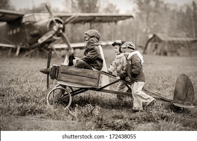 Young aviators at the airport with a homemade airplane