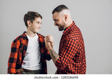 young awesome daddy supports his child before the competition.love, help, fatherhood, parenthood, assistance. close up photo. isolated wite background
