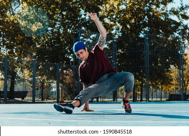 Young B Boy Dancing And Posing At Basketball Court