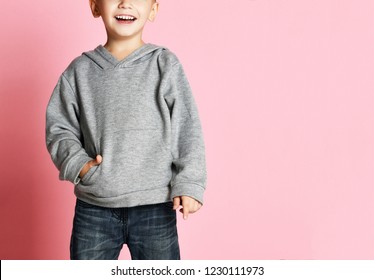 Young Baby Boy Kid In Grey Hoodie And Blue Jeans With Free Text Copy Space Happy Smiling On Pink Background